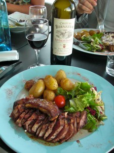 Duck topped with foie gras and served with Bordeaux red.